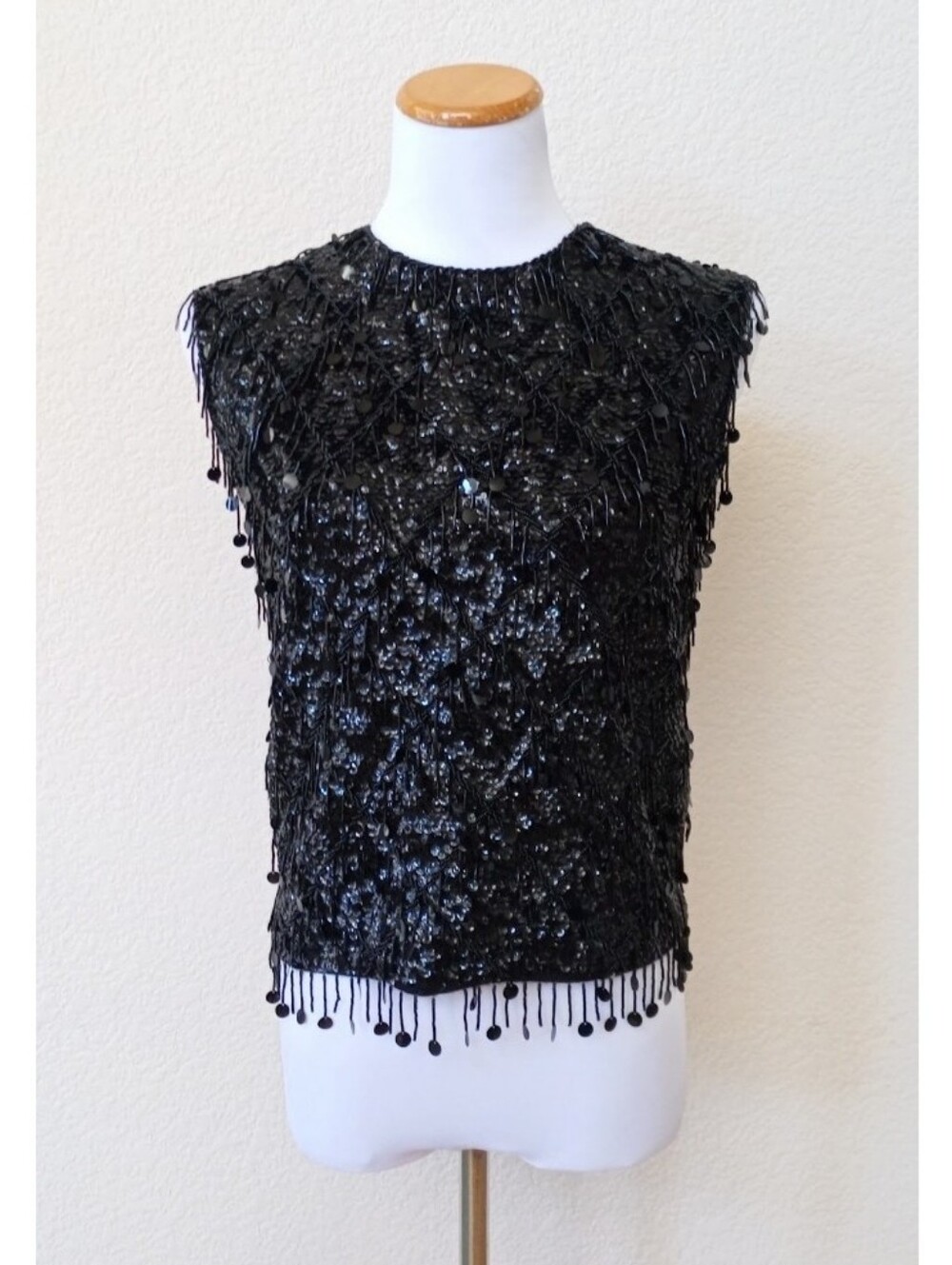 Vintage 1960s black sleeveless top with intricate beadwork and fringe detailing